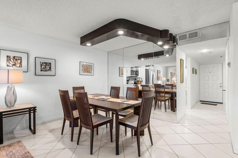 7310 Ashford Place, Unit 803 Delray Beach, FL 33446 - Photo 8 of 26 a view of a dining room with furniture