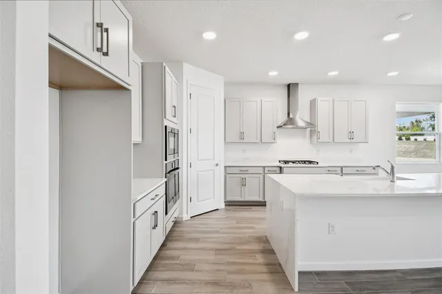a bathroom with a granite countertop sink mirror toilet and shower