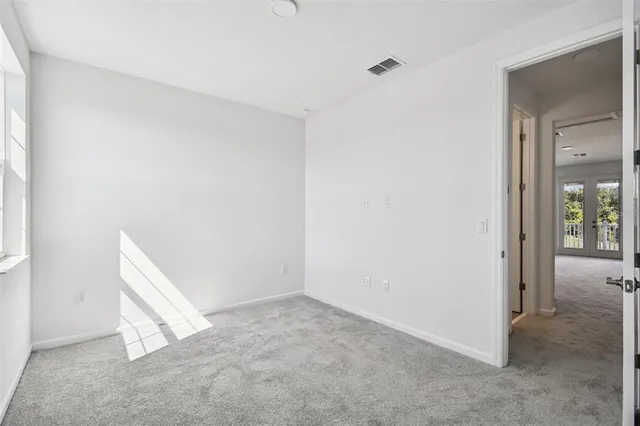 a bathroom with a shower and a sink