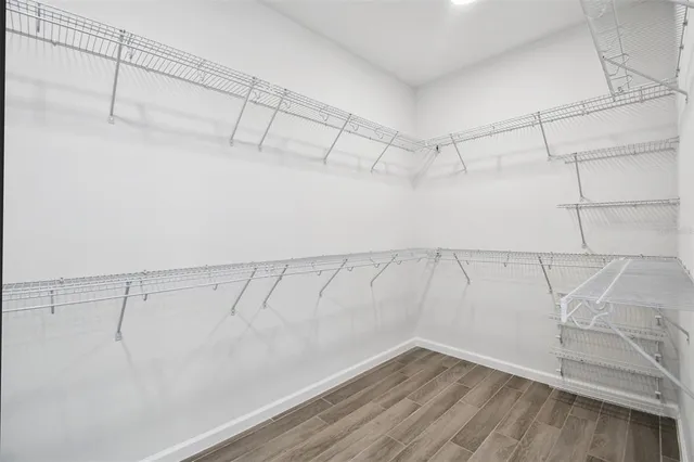 a bathroom with a shower sink vanity mirror and toilet