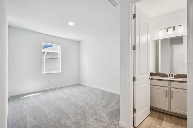 an empty room with closet area