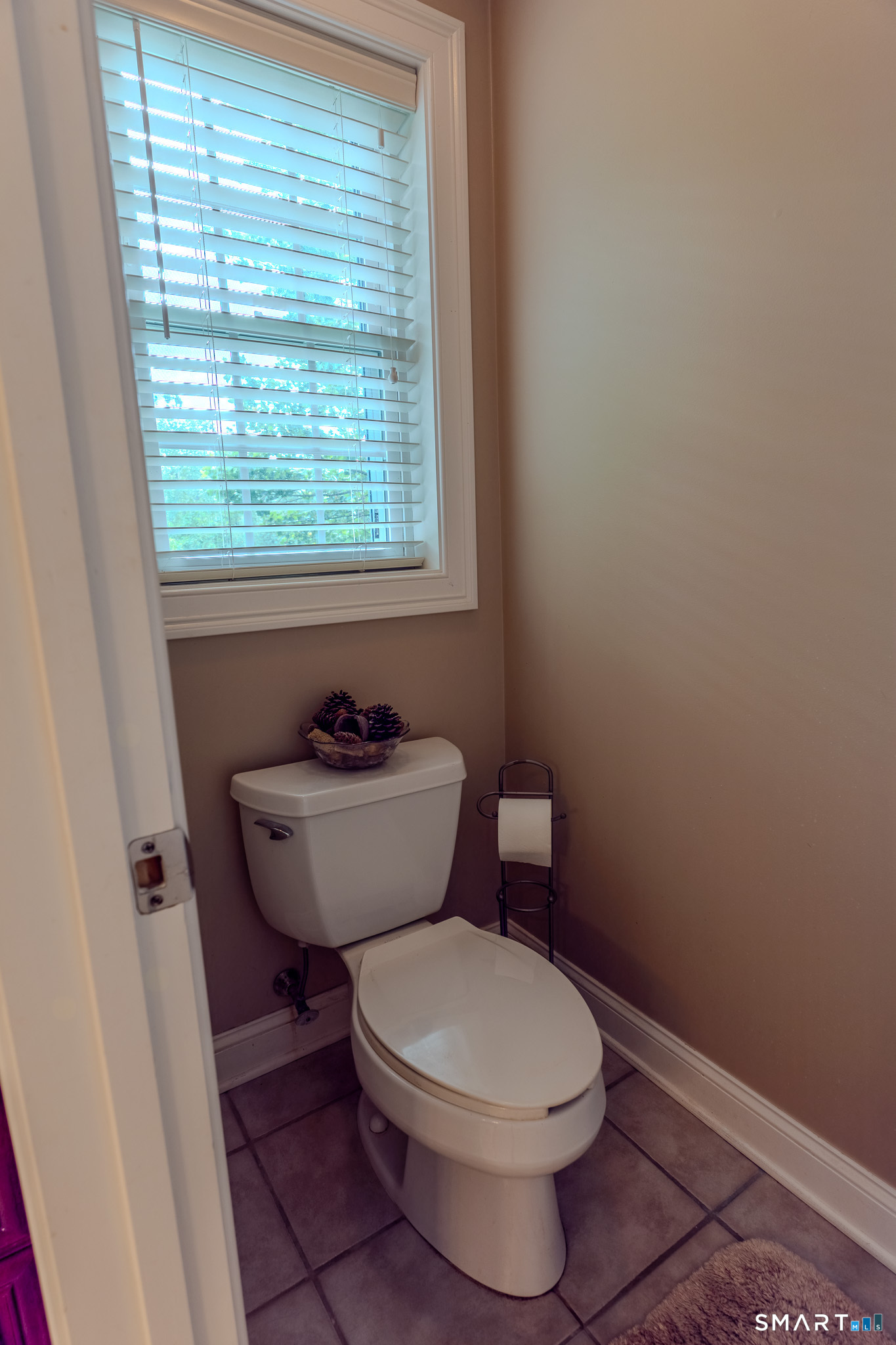 4 Ortense Road Wallingford, CT 06492 - Photo 21 of 33 a bathroom with a toilet a sink and a window