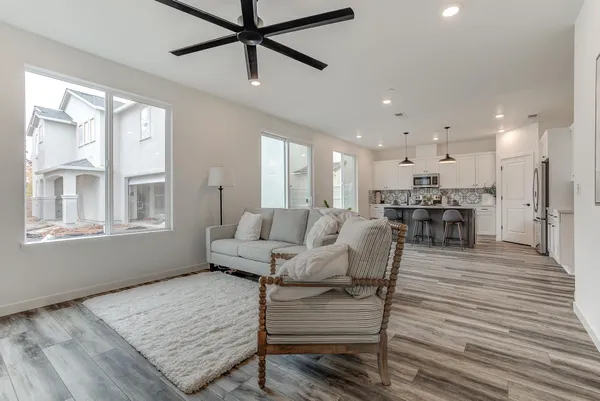 a living room with furniture and a table