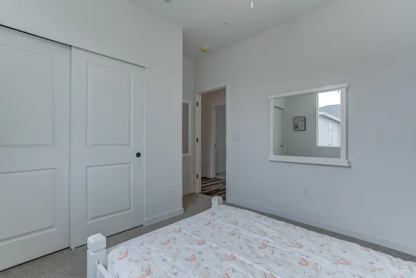 a bedroom with a bed and a bathroom