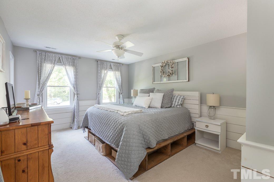 3 Hitching Rack Court Durham, NC 27713 - Photo 5 of 9 a spacious bedroom with a bed and a dresser