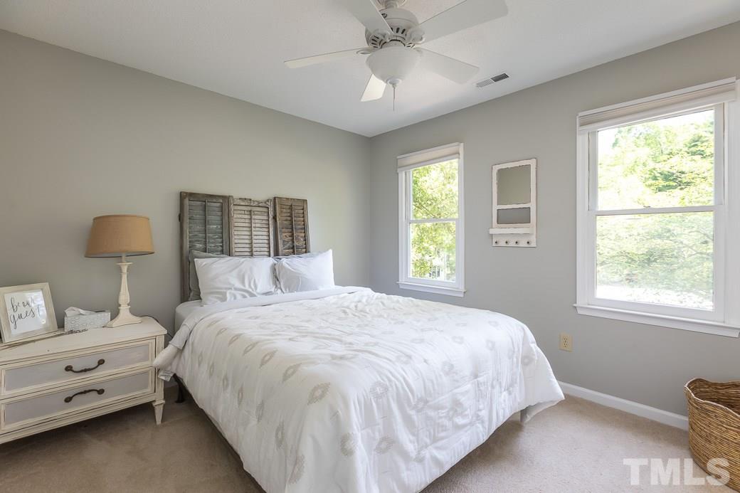 3 Hitching Rack Court Durham, NC 27713 - Photo 8 of 9 a bedroom with a bed and a window