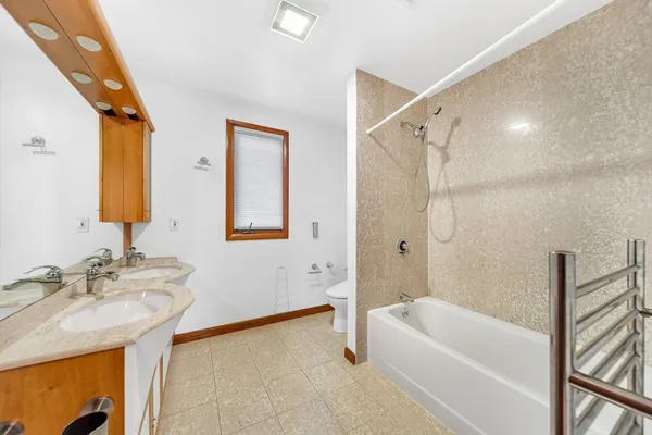 a bathroom with a sink a mirror and a bathtub
