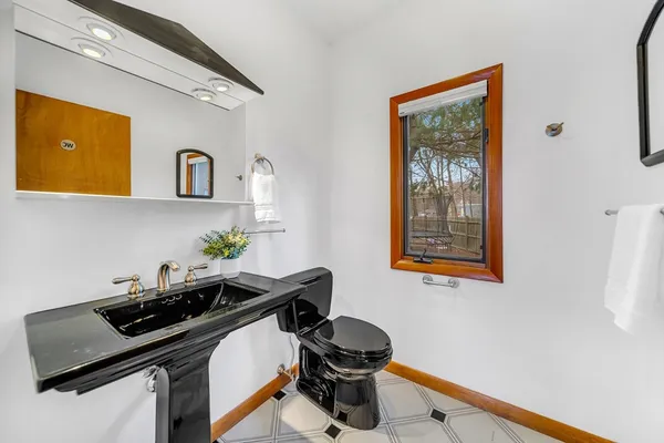 a kitchen with stainless steel appliances a sink a stove and a window