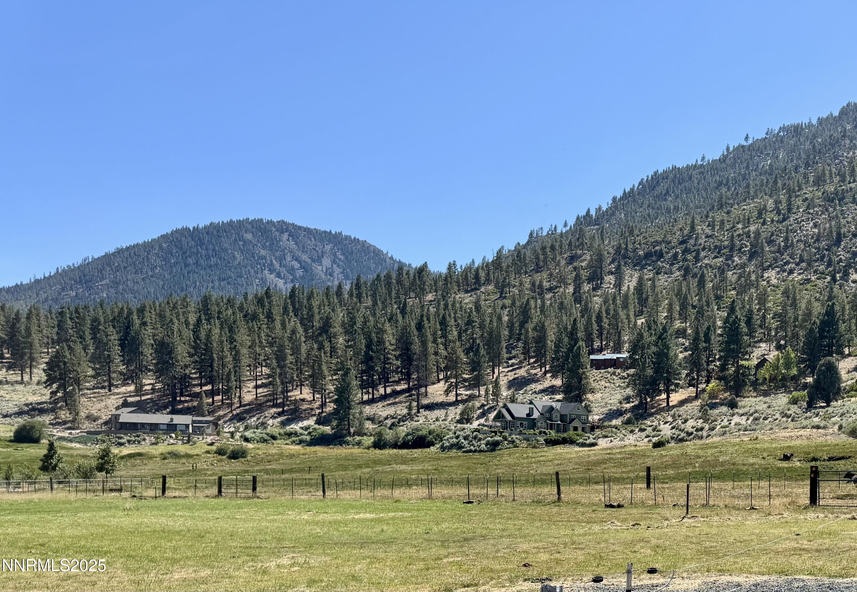 565 Jackson Ranch Road Gardnerville, NV 89460 - Photo 4 of 13 a view of a lake with a house in the background