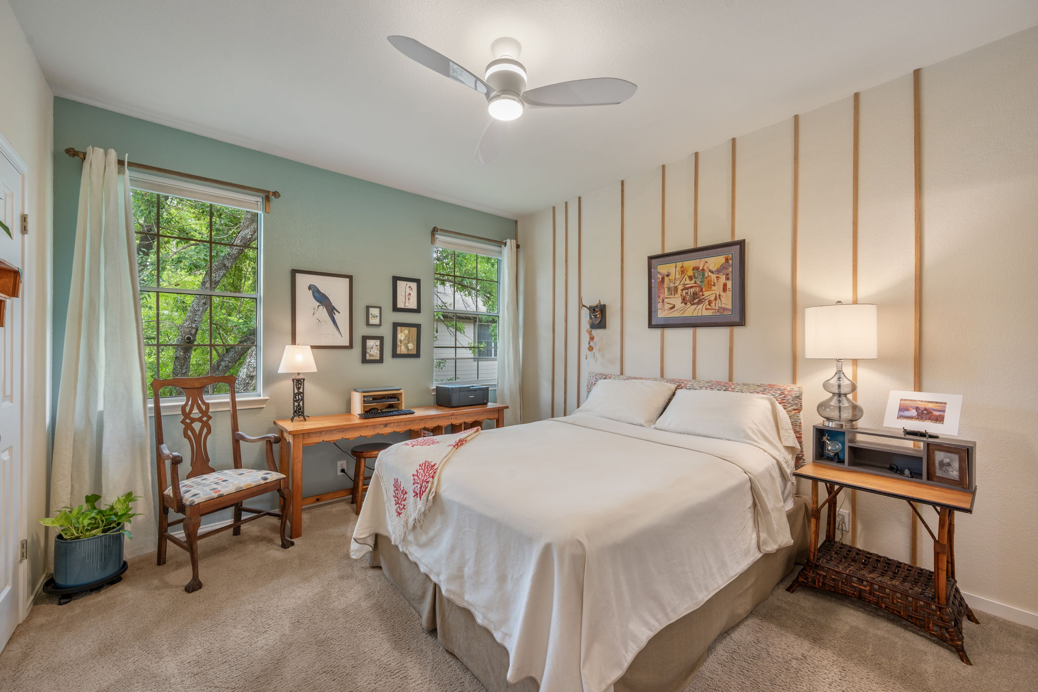 12401 Los Indios Trail, Unit 32 Austin, TX 78729 - Photo 16 of 39 The plush carpeted bedroom includes multiple sun-filled windows.