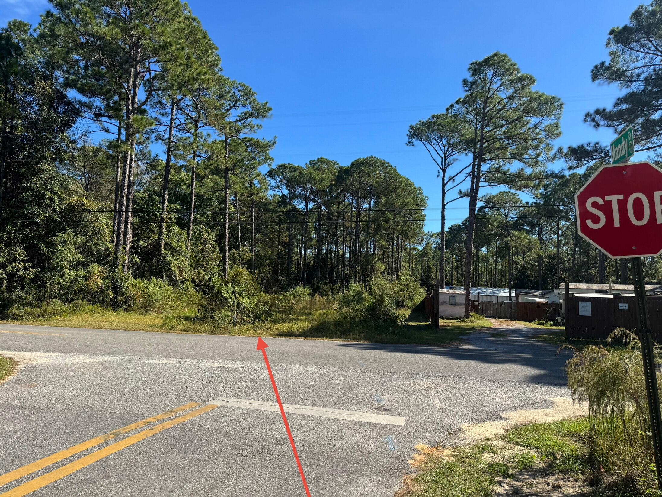 Lot 11 Indian Woman Road Santa Rosa Beach, FL 32459 - Photo 2 of 3 a view of a street with a building in the background