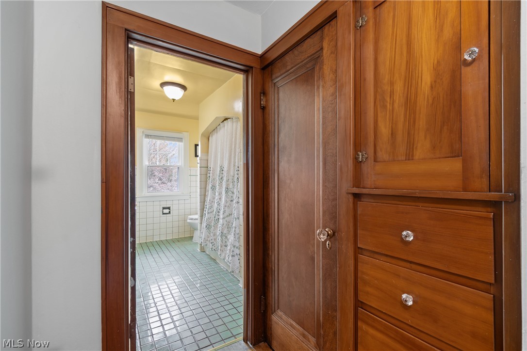 2214 Cleveland Road Wooster, OH 44691 - Photo 22 of 38 This picture was taken from the hallway into the main bath. There is ample space in the linen closet and the door next to it goes up to the 3rd floor bonus room which is already enclosed and insulated.