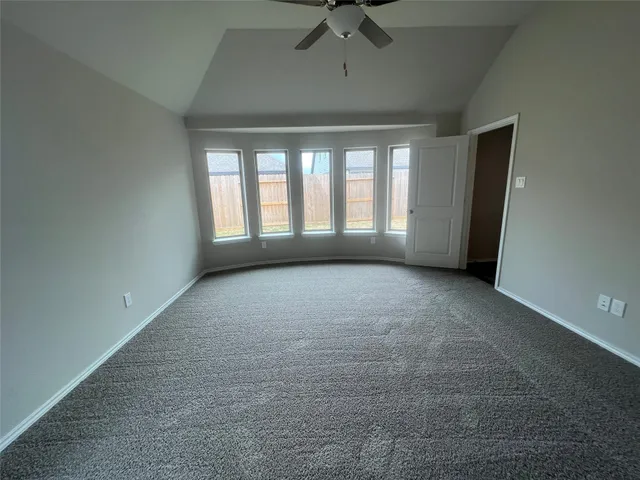 a view of hallway with wooden floor