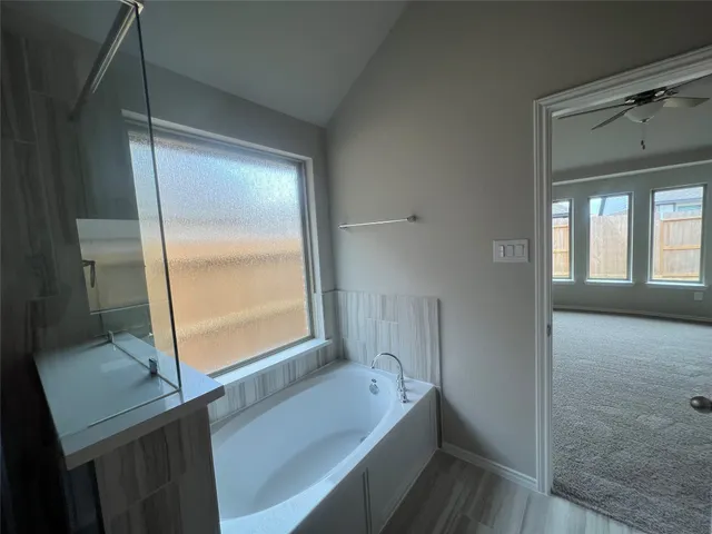 a kitchen with kitchen island sink stove and refrigerator