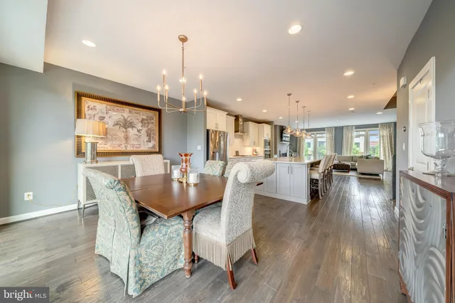 a dining room with furniture and wooden floor