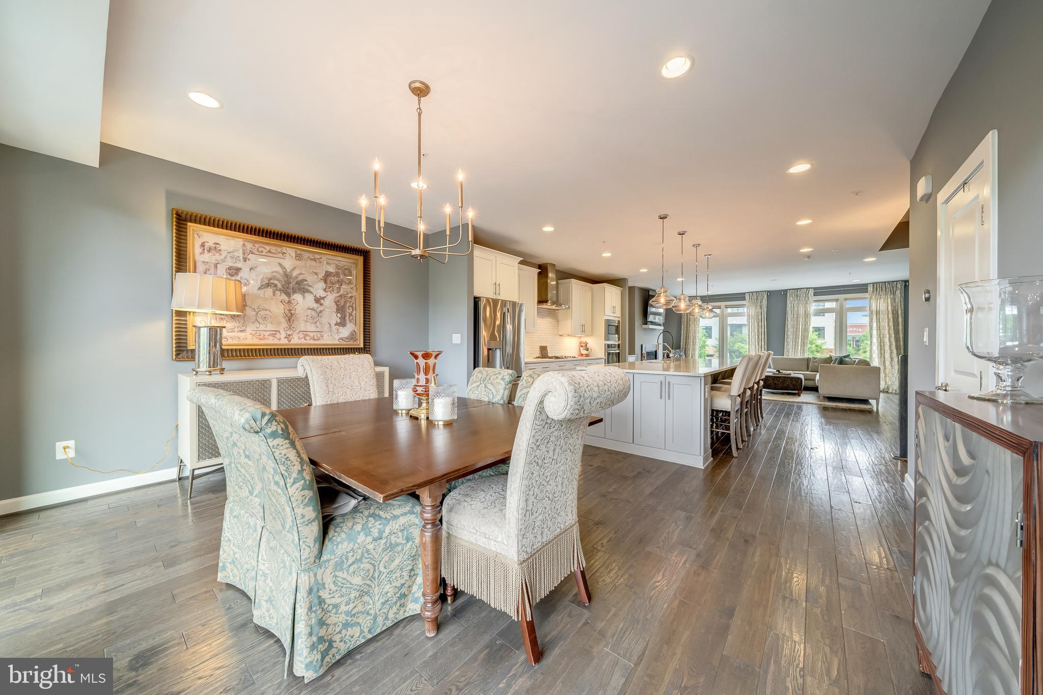 1521 Ribbon Limestone Terrace Southeast Leesburg, VA 20175 - Photo 20 of 34 a dining room with furniture and wooden floor