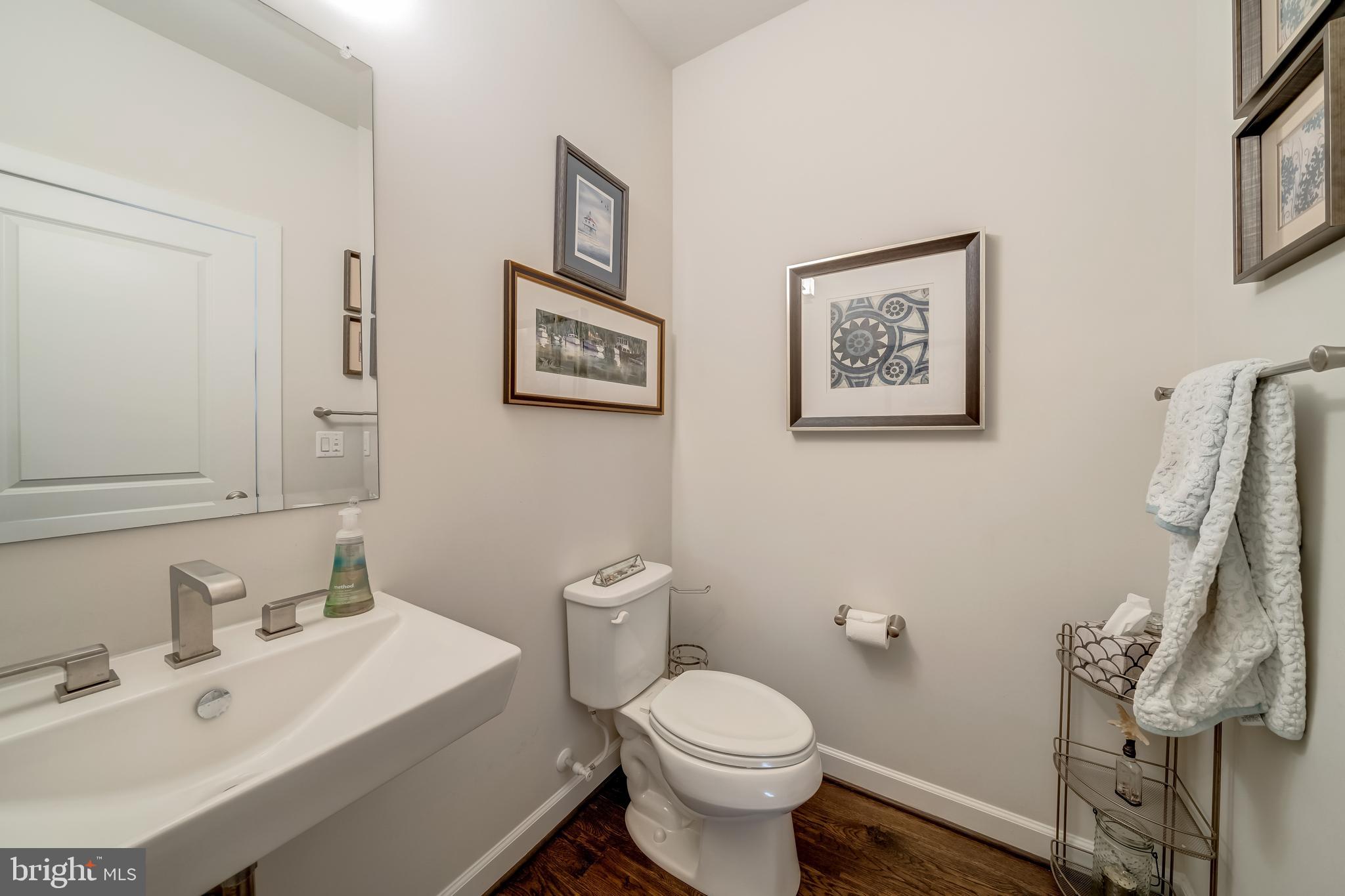 1521 Ribbon Limestone Terrace Southeast Leesburg, VA 20175 - Photo 21 of 34 a bathroom with a sink mirror and toilet