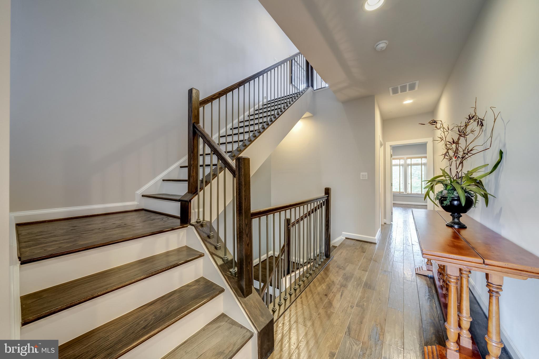 1521 Ribbon Limestone Terrace Southeast Leesburg, VA 20175 - Photo 22 of 34 a view of entryway and hall with wooden floor
