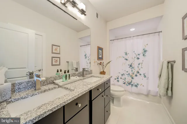 a utility room with a sink dryer and washer