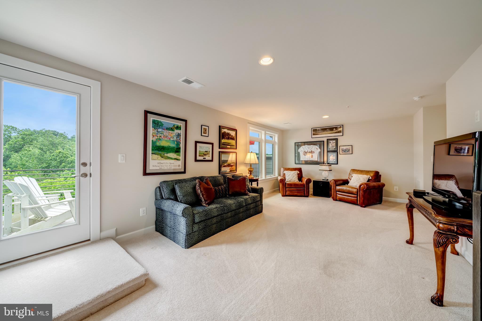 1521 Ribbon Limestone Terrace Southeast Leesburg, VA 20175 - Photo 30 of 34 a living room with furniture and a large window
