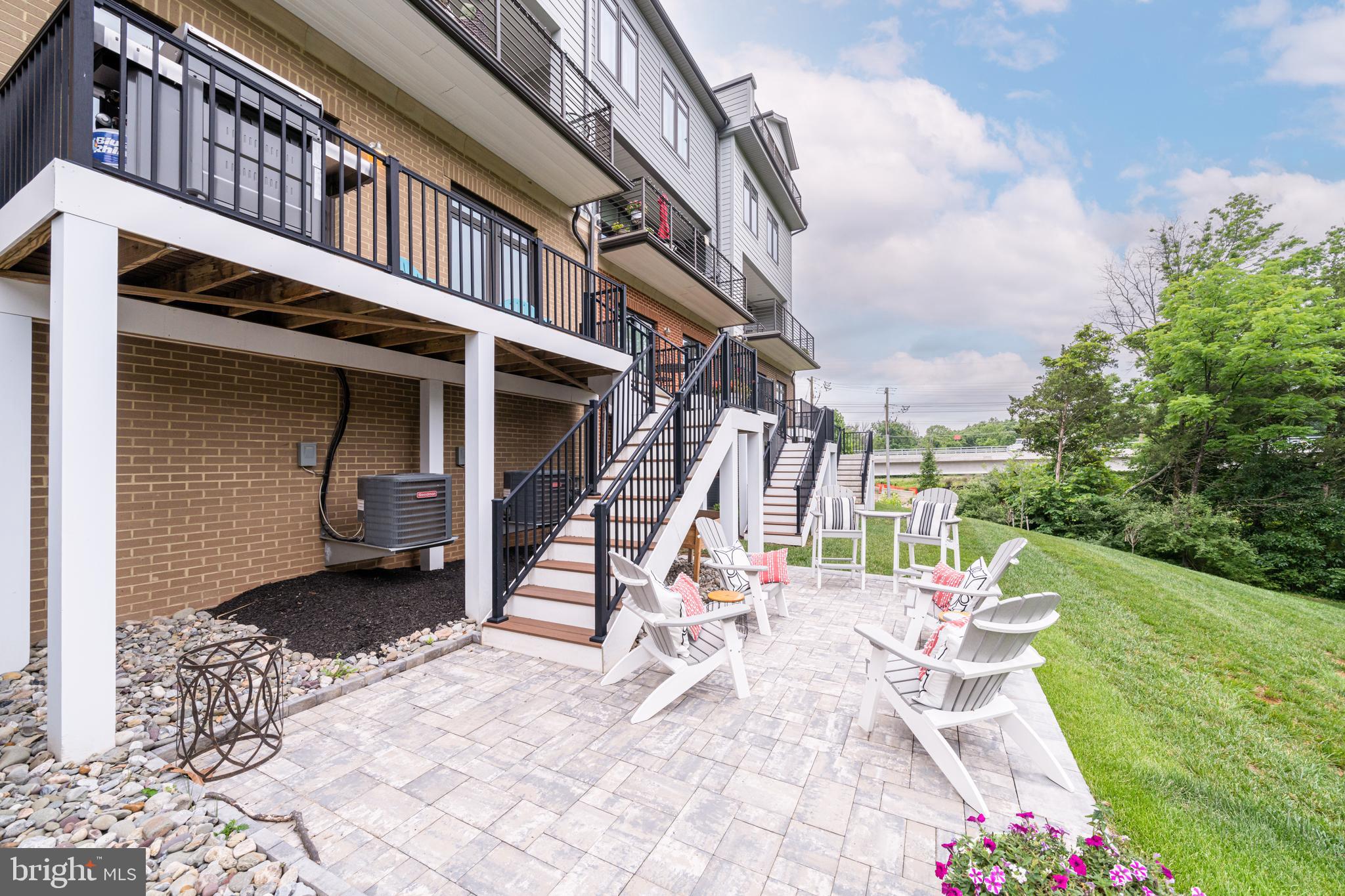 1521 Ribbon Limestone Terrace Southeast Leesburg, VA 20175 - Photo 3 of 34 a view of a chairs with a table and chairs in roof deck