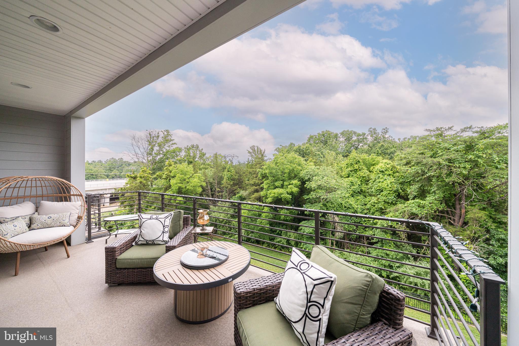 1521 Ribbon Limestone Terrace Southeast Leesburg, VA 20175 - Photo 6 of 34 a view of a roof deck with a table and chairs