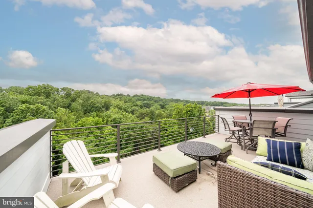 an outdoor sitting area with furniture