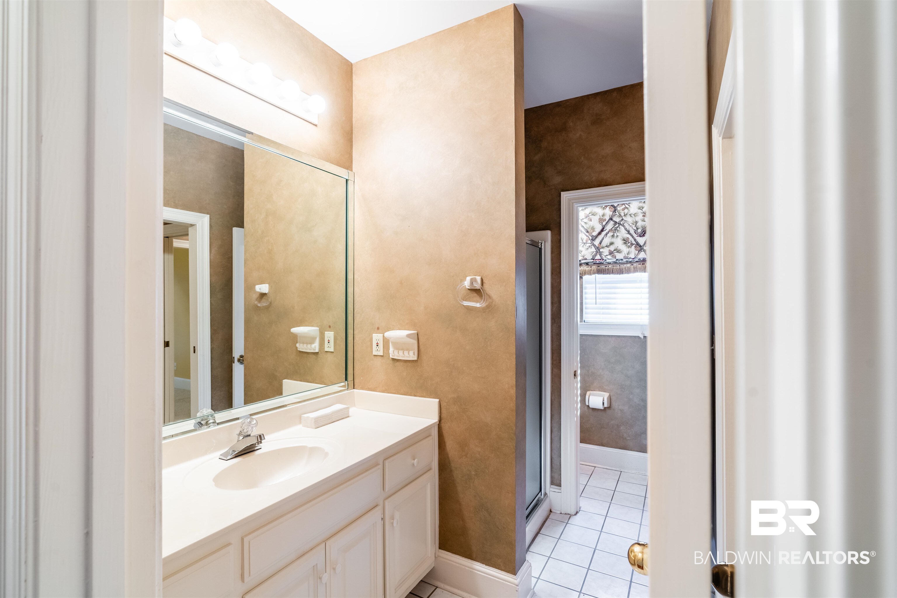 3821 St Andrews Loop East Mobile, AL 36693 - Photo 24 of 41 Bathroom with vanity, walk in shower, and tile patterned flooring