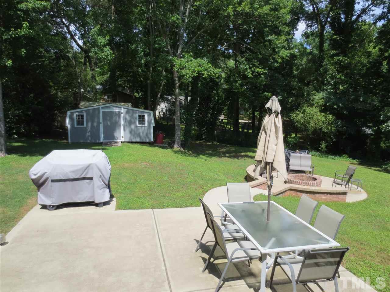 7608 Copper Mine Lane Raleigh, NC 27615 - Photo 22 of 25 a view of a backyard with sitting area
