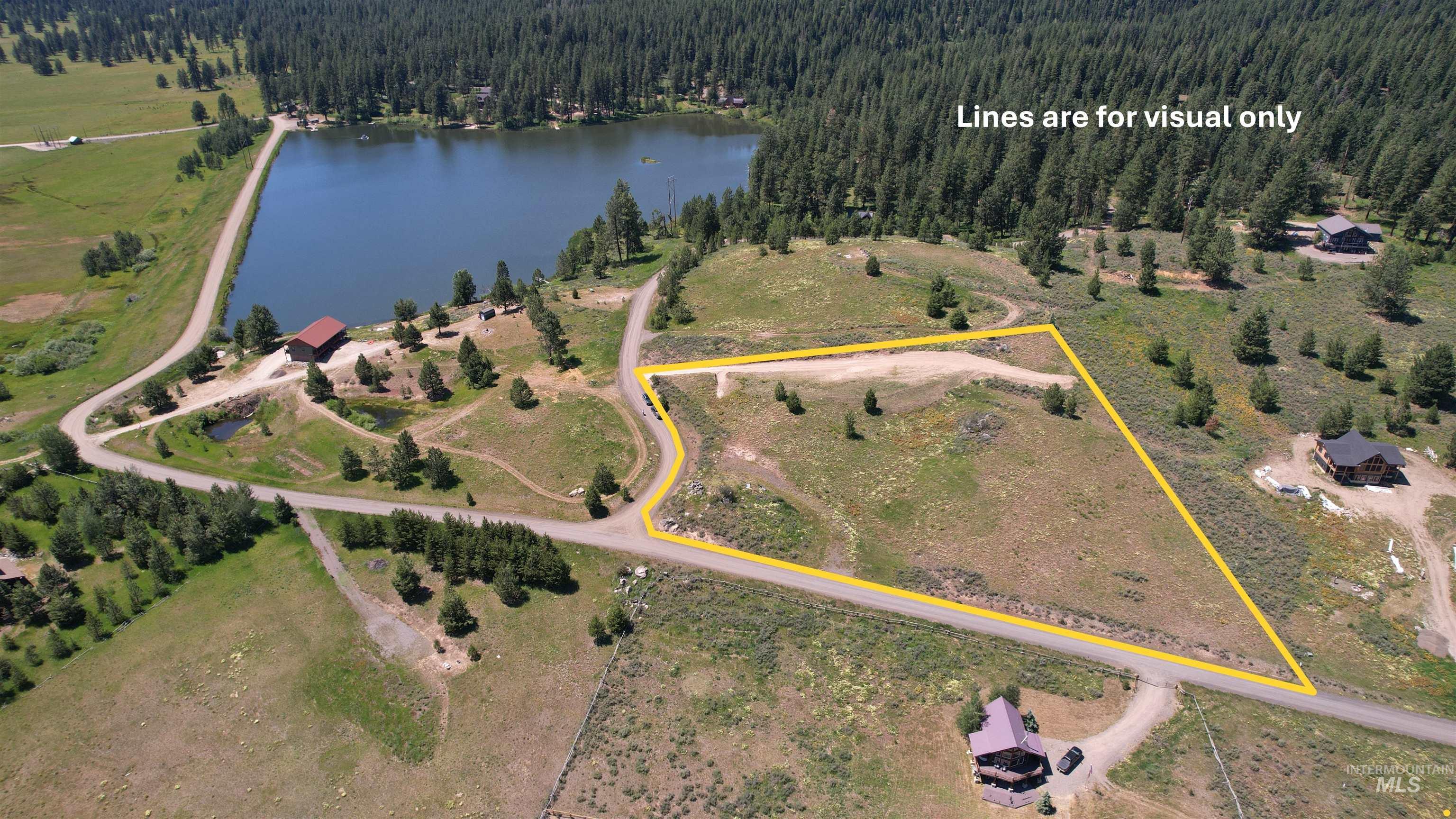 Lot 7 Wilderness Ranch Lane Cascade, ID 83611 - Photo 1 of 46 Aerial view of property and surrounding area with a large body of water and property boundaries highlighted