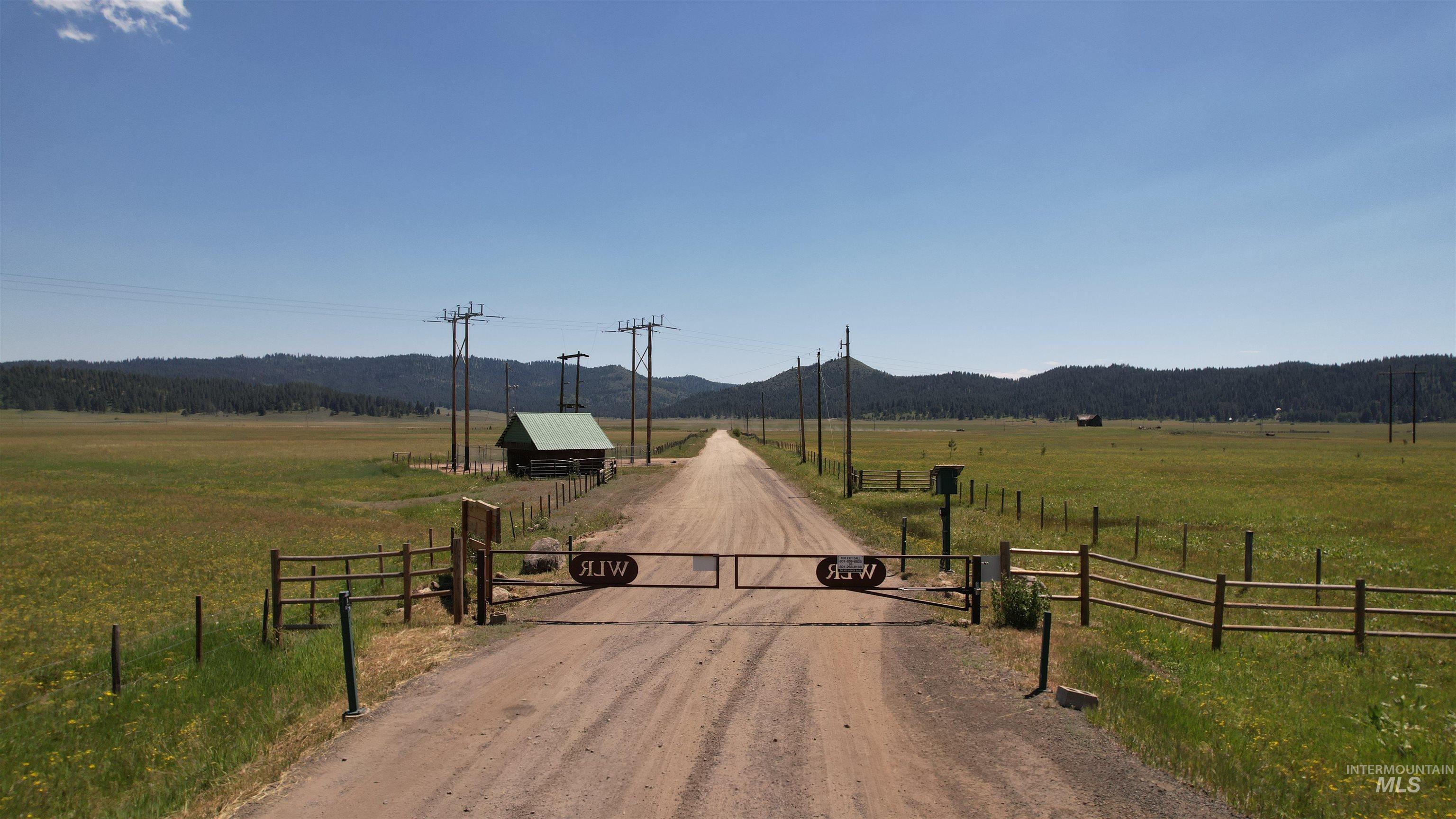 Lot 7 Wilderness Ranch Lane Cascade, ID 83611 - Photo 26 of 46 View of dirt / gravel road featuring a view of countryside and a mountain view