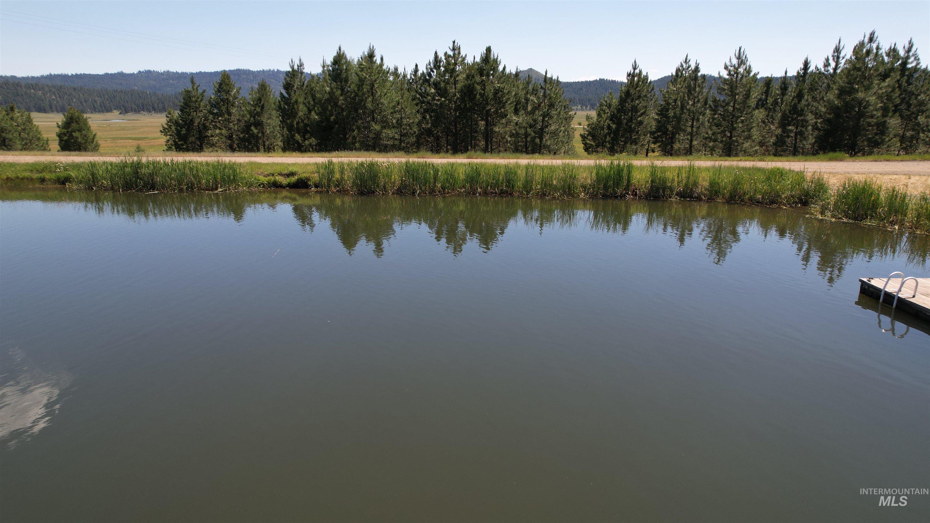 Lot 7 Wilderness Ranch Lane Cascade, ID 83611 - Photo 31 of 46 Water view with a heavily wooded area and a mountainous background