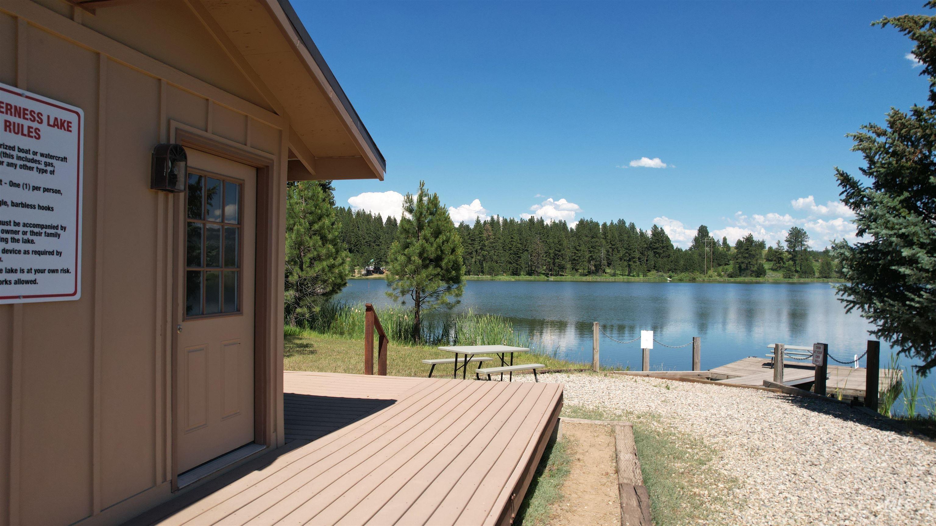 Lot 7 Wilderness Ranch Lane Cascade, ID 83611 - Photo 35 of 46 Wooden terrace with a water view, a wooded view, and a boat dock