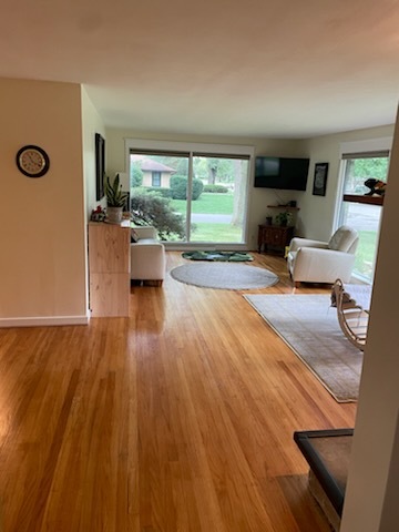 1008 Broadmoor Drive Champaign, IL 61821 - Photo 3 of 8 a living room with furniture and a flat screen tv