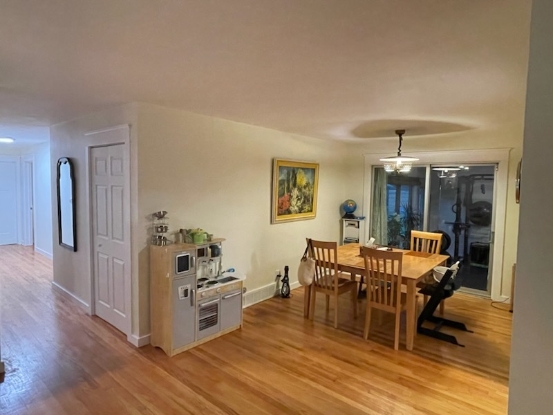 1008 Broadmoor Drive Champaign, IL 61821 - Photo 5 of 8 a view of a dining room with furniture window and wooden floor