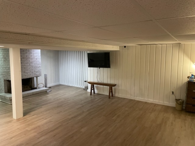 1008 Broadmoor Drive Champaign, IL 61821 - Photo 8 of 8 a view of a livingroom with a flat screen tv wooden floor and a fireplace