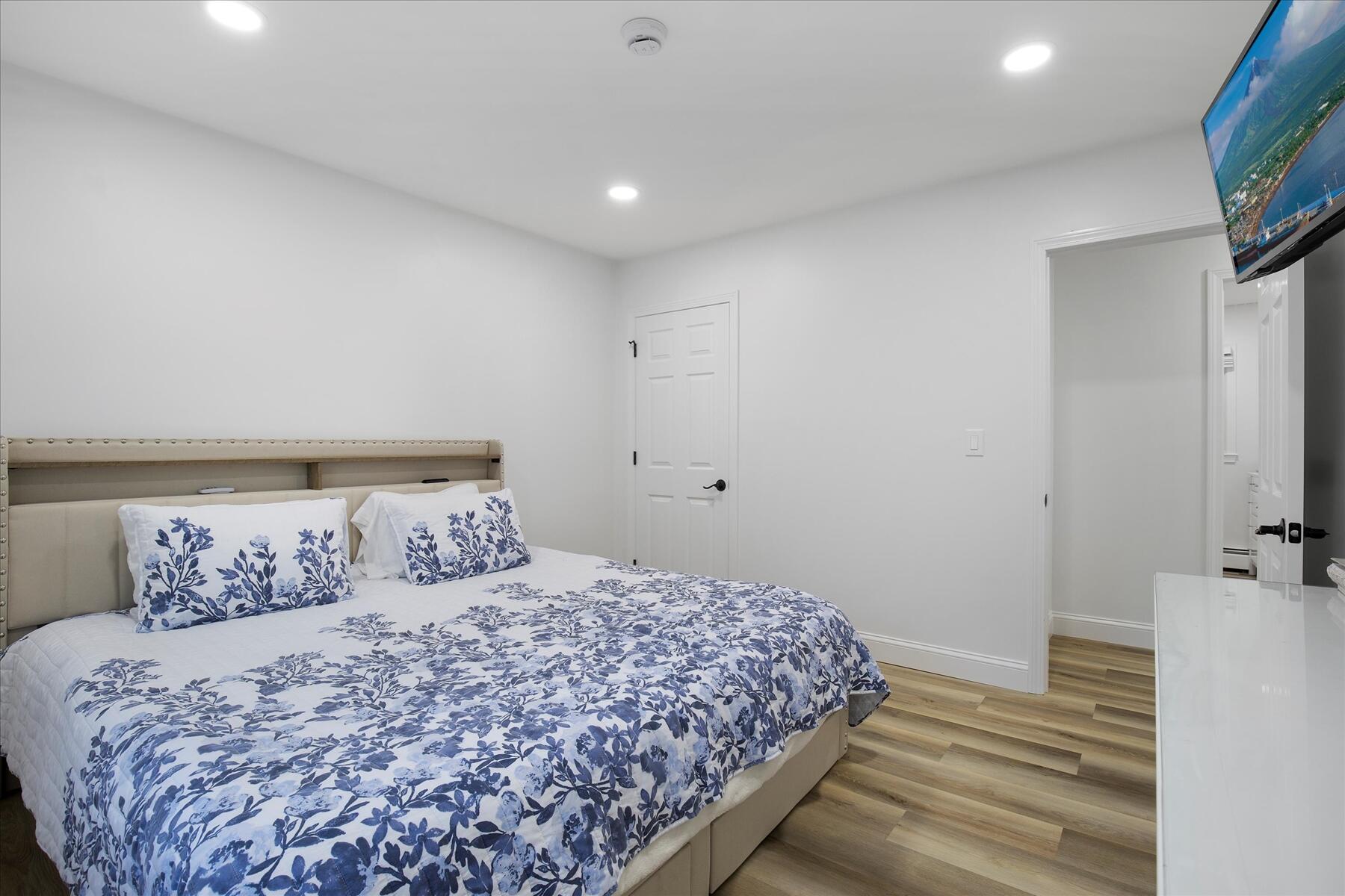 65 Marsh Lane Hyannis, MA 02601 - Photo 11 of 22 a bedroom with a bed and a flat screen tv