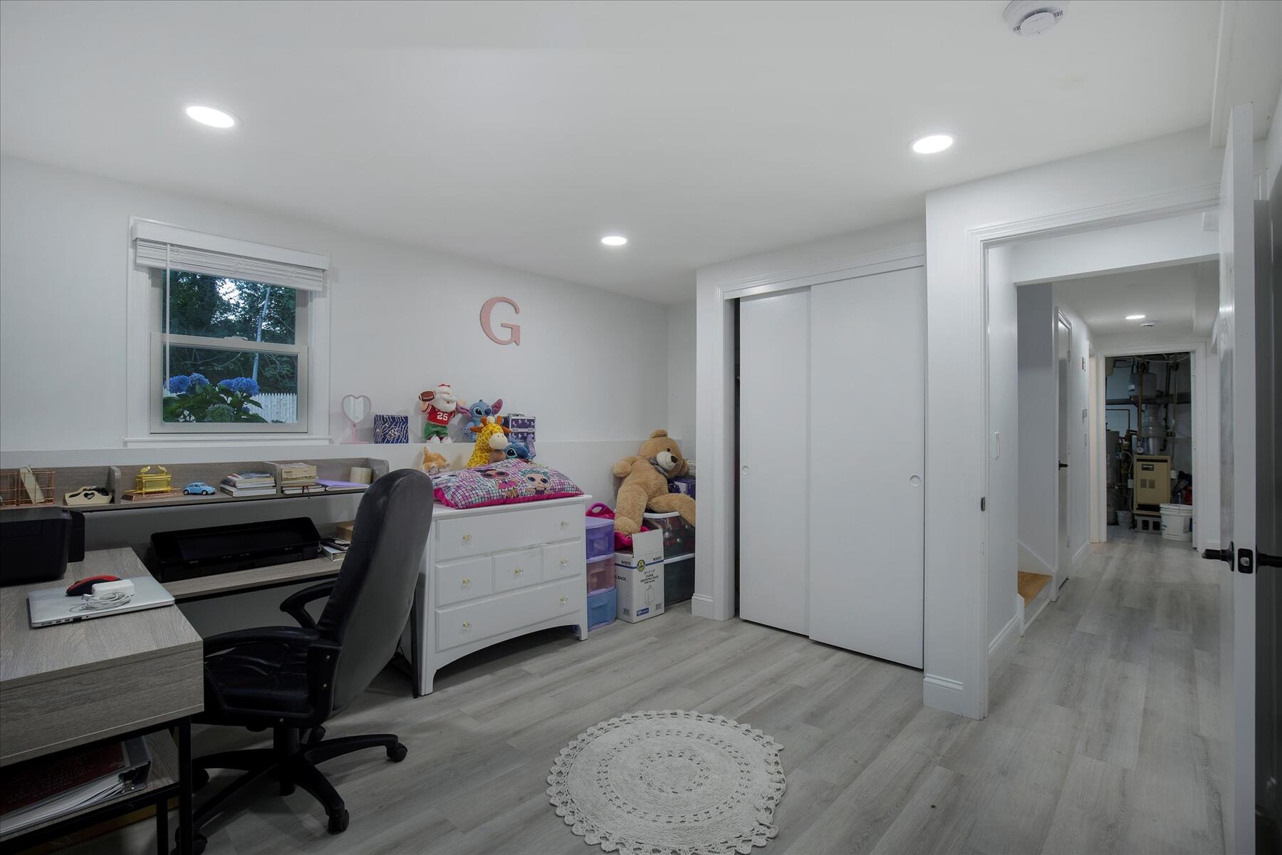 65 Marsh Lane Hyannis, MA 02601 - Photo 15 of 22 a living room with furniture and a wooden floor