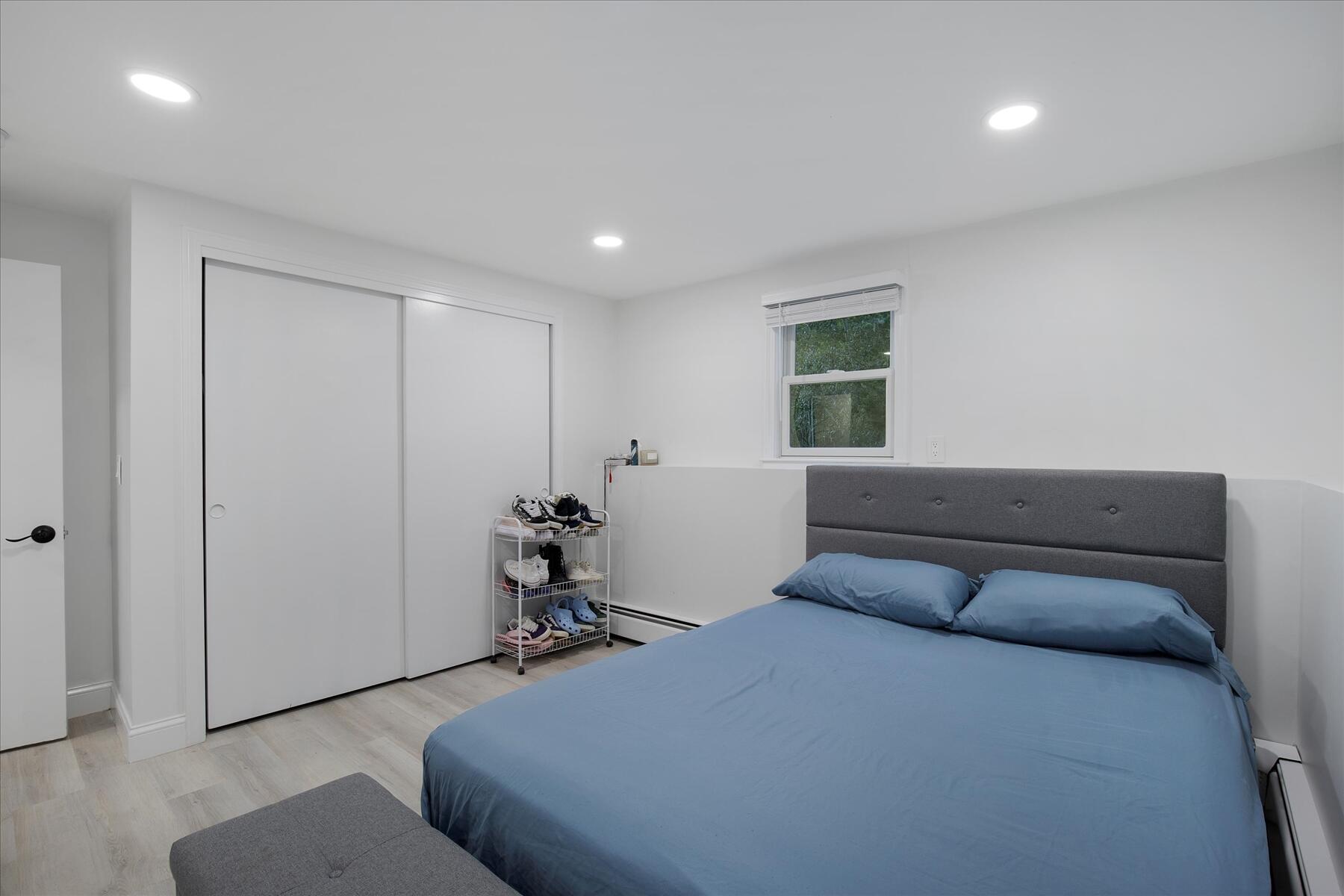 65 Marsh Lane Hyannis, MA 02601 - Photo 17 of 22 a bed room with a bed and a couch
