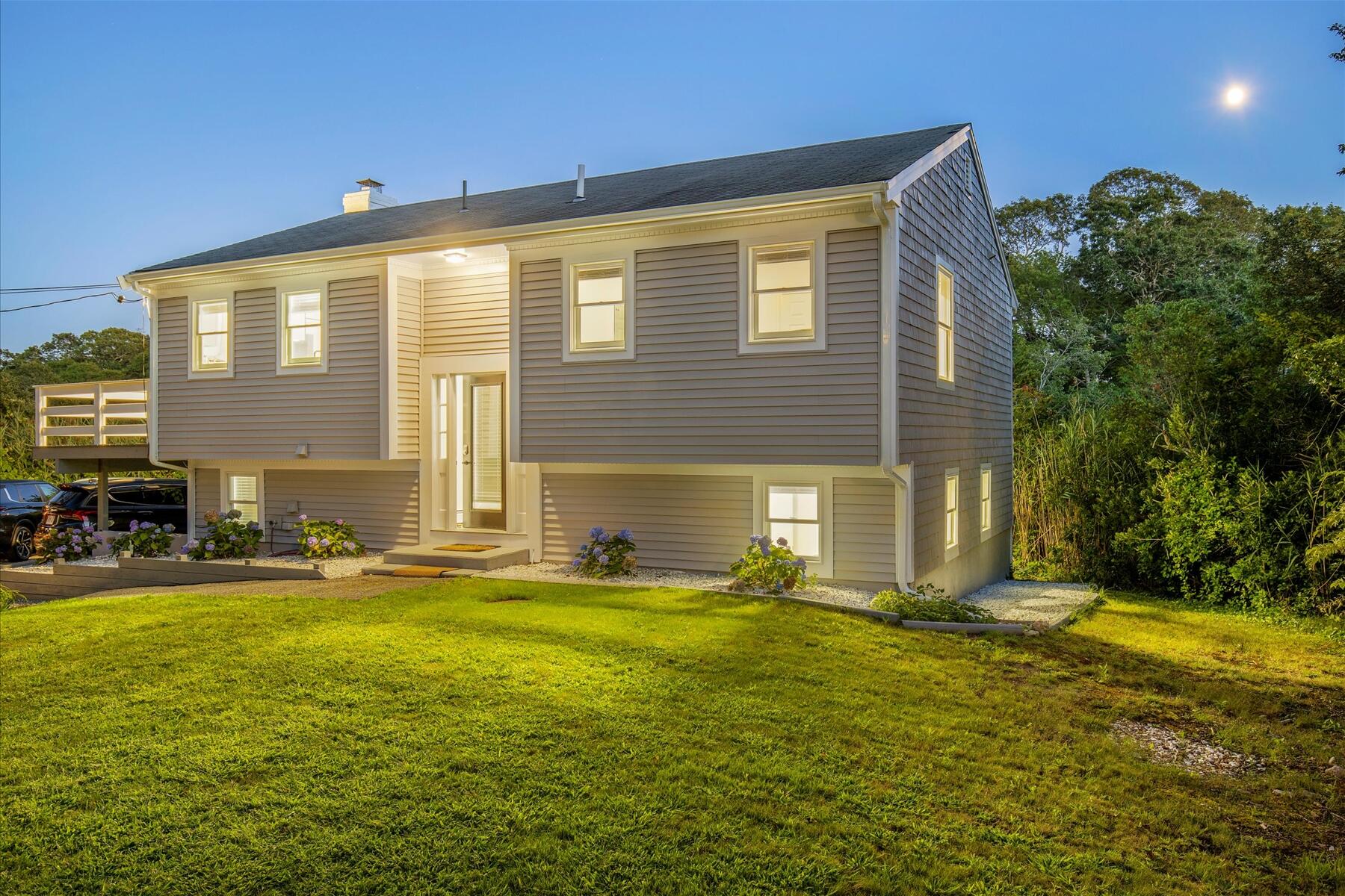 65 Marsh Lane Hyannis, MA 02601 - Photo 2 of 22 a view of a house with a yard
