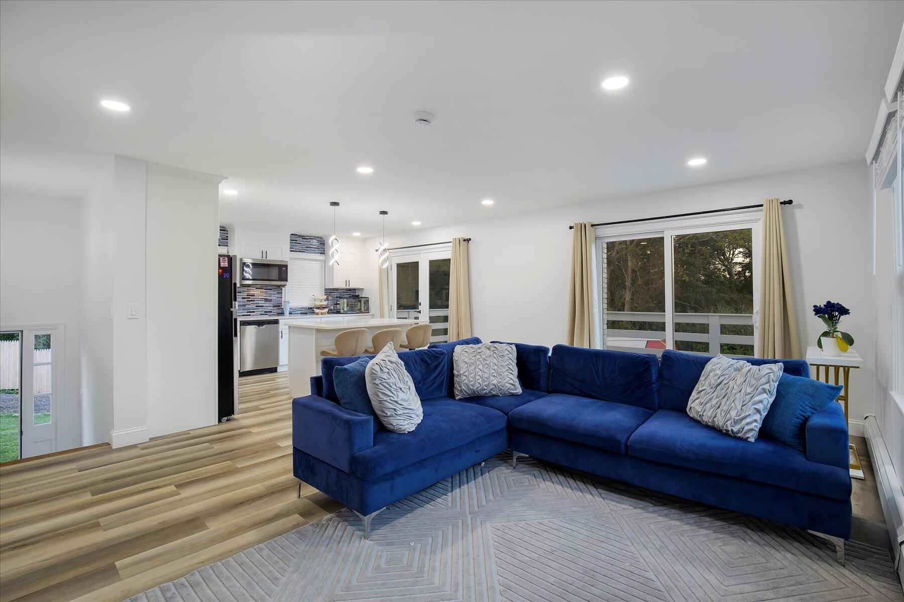 65 Marsh Lane Hyannis, MA 02601 - Photo 5 of 22 a living room with furniture and a large window