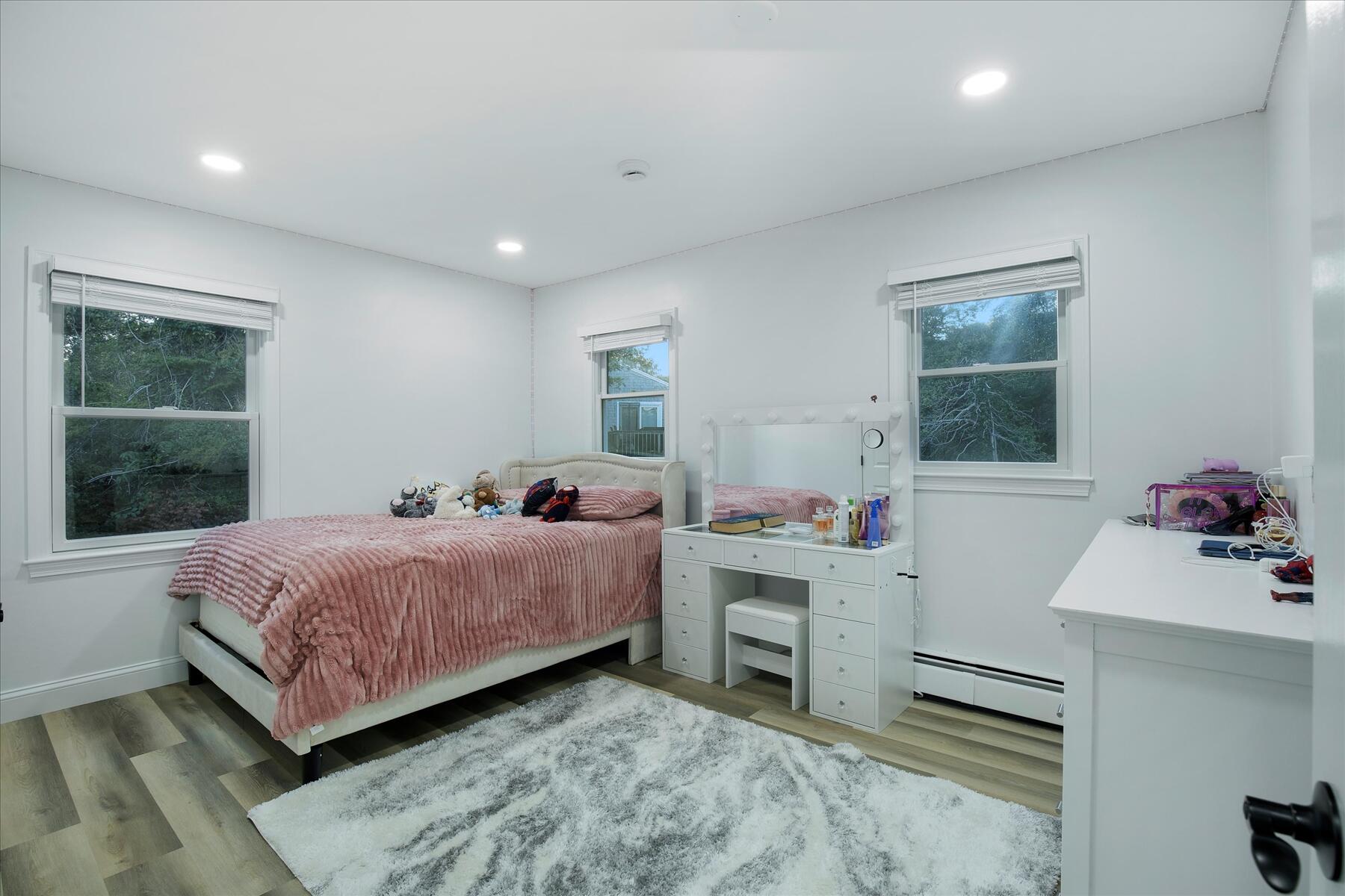 65 Marsh Lane Hyannis, MA 02601 - Photo 8 of 22 a room with a bed and a dresser