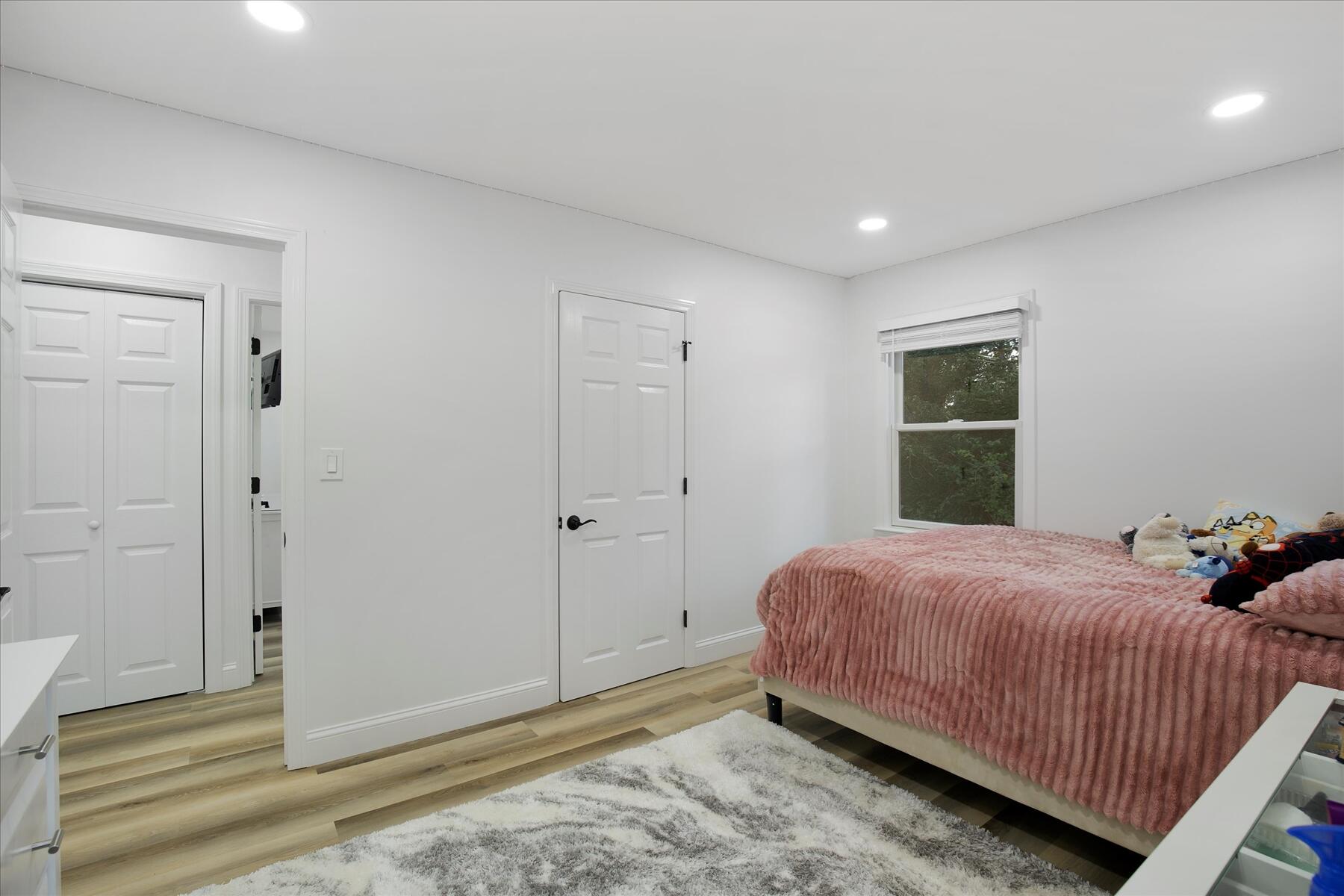 65 Marsh Lane Hyannis, MA 02601 - Photo 9 of 22 a bedroom with a bed and a window
