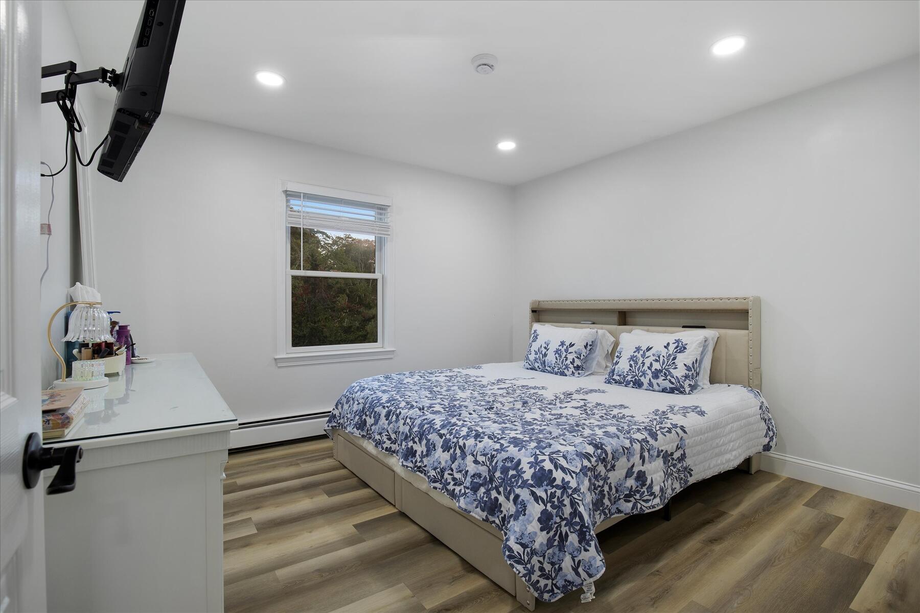 65 Marsh Lane Hyannis, MA 02601 - Photo 10 of 22 a bedroom with a bed and a window