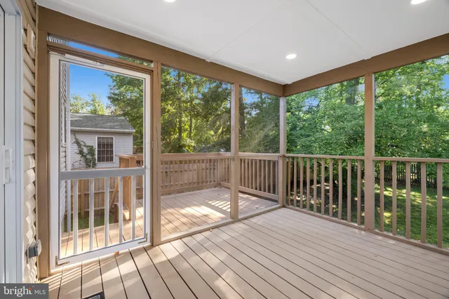 a view of a balcony with wooden floor