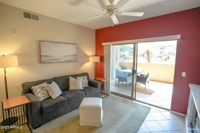 a living room with a table and chairs