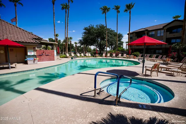 a view of kitchen with stainless steel appliances and cabinets