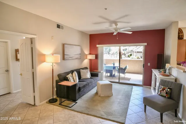 a living room with furniture and a large window