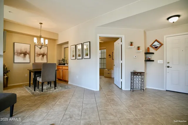 a view of a livingroom with furniture and a dining table