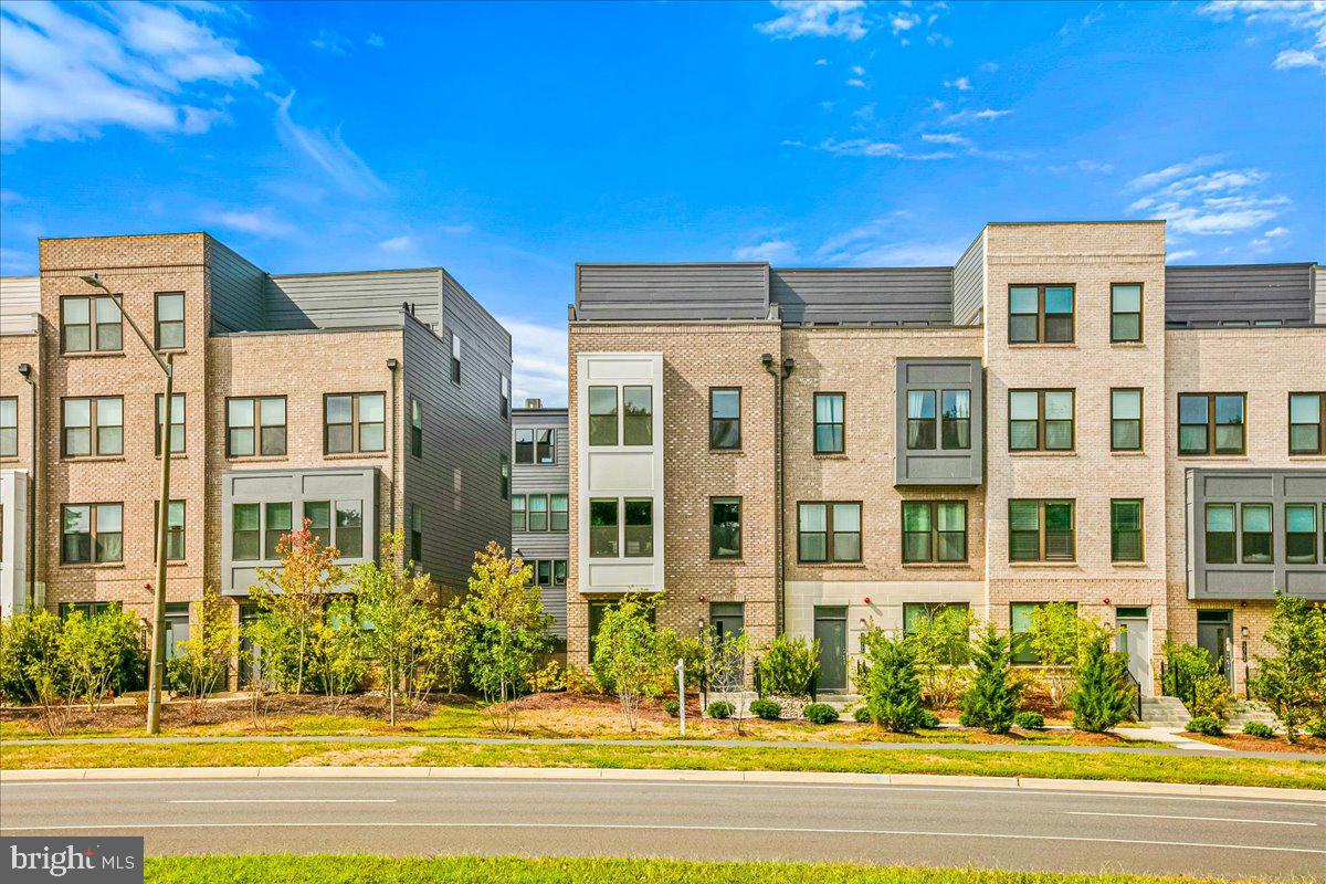 a view of a building with a yard